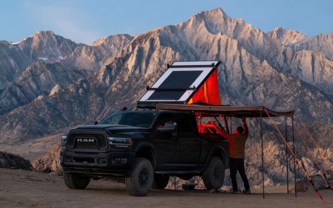 An Overland vehicle with its awning deployed