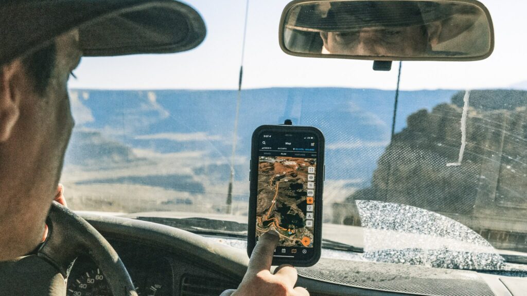 A man uses an app to navigate in the high Utah desert
